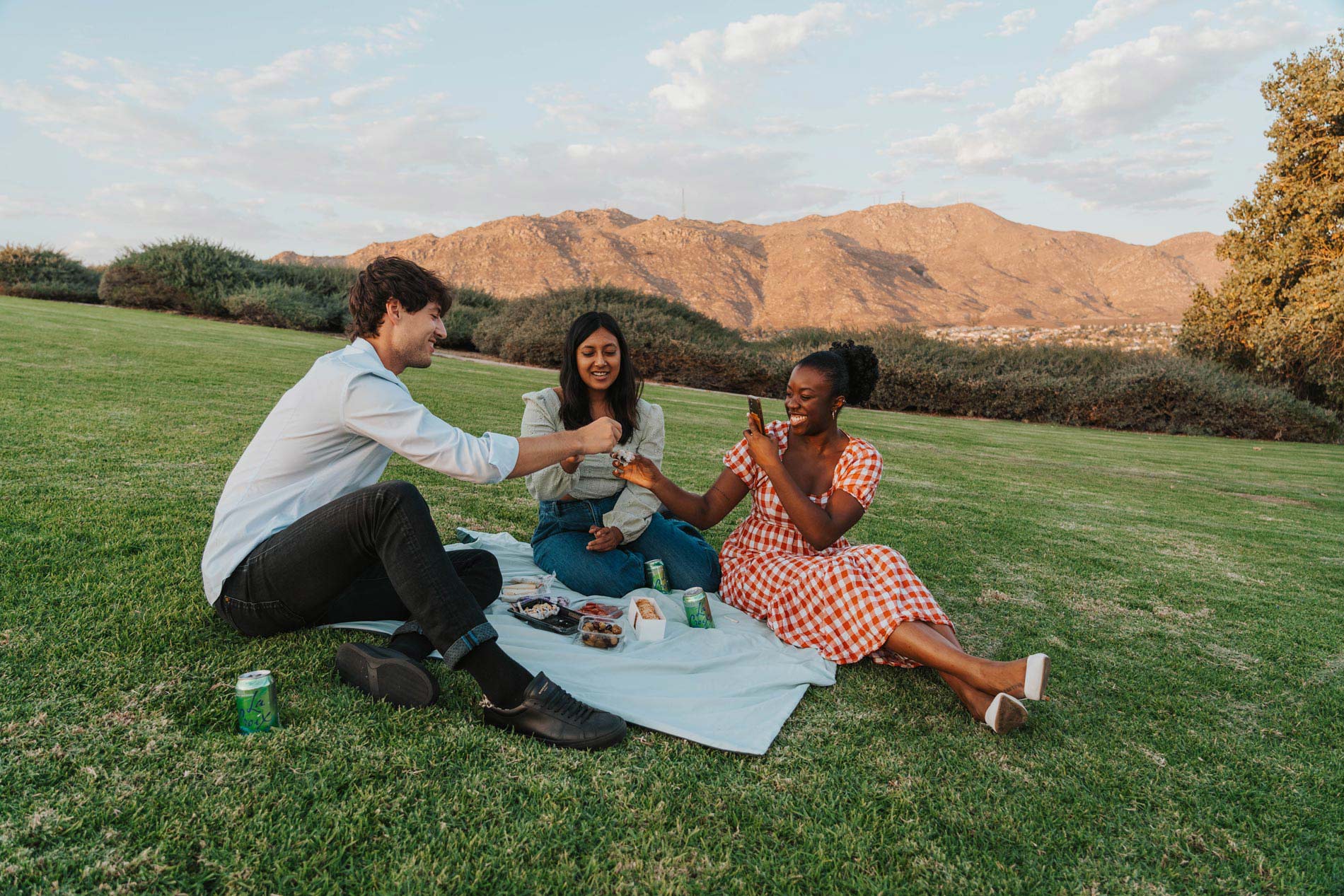 Windermere three people picnic at Sycamore Highlands Park