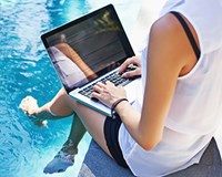 gig smart woman laptop pool