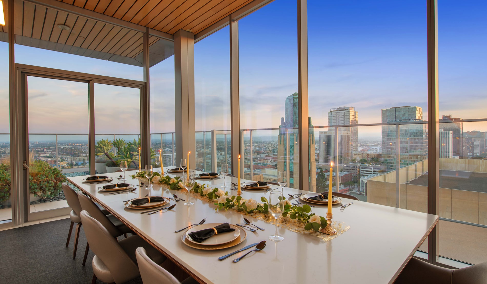 3033 Wilshire Apartments Set Dining Table in the Rooftop Lounge at Sunset