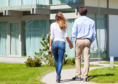 woman and man touring apartment community