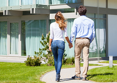 woman and man touring apartment community woman and man touring apartment community