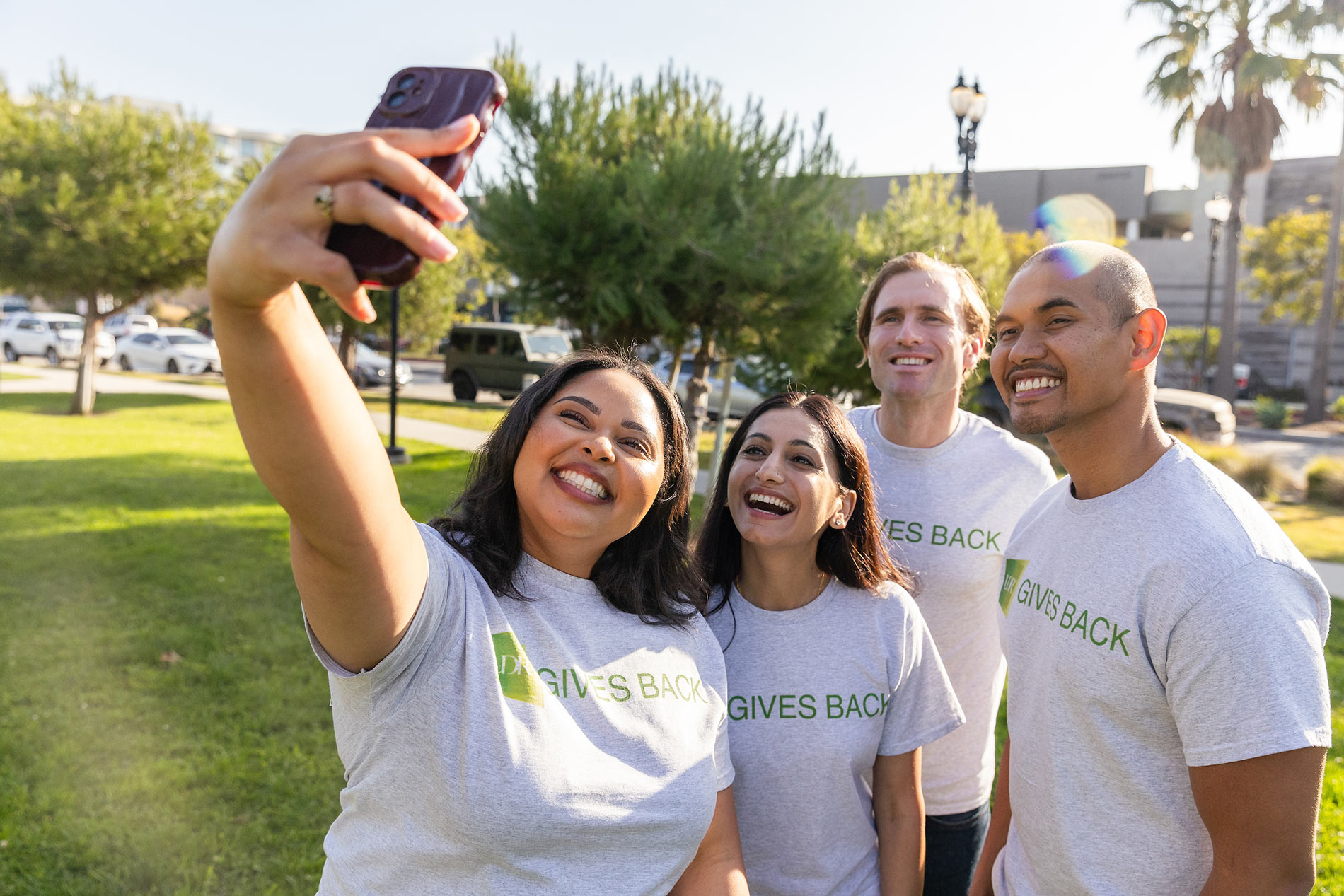 four people taking a selfie