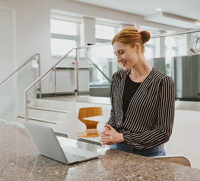 Woman using laptop in 21 Chelsea lobby