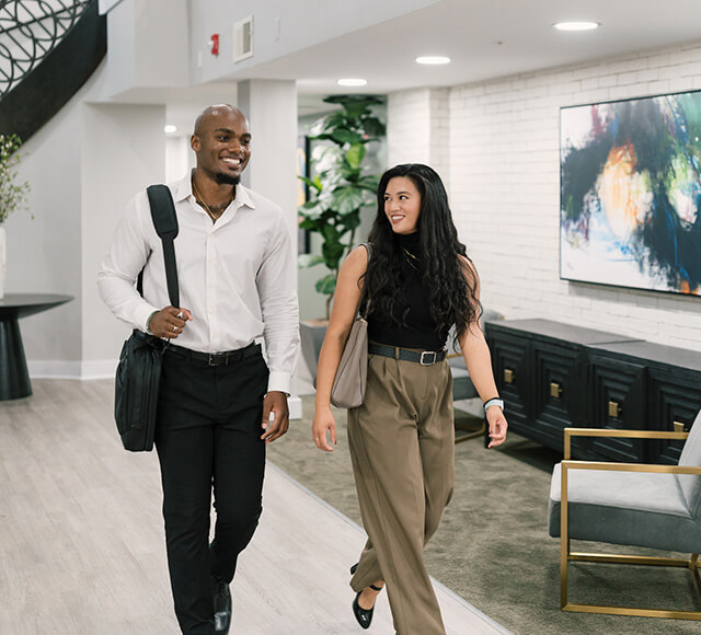 Man and woman touring apartment community