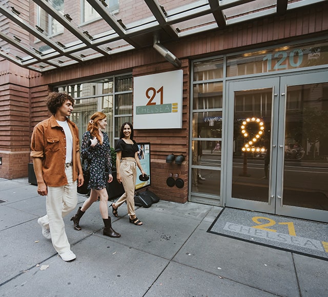 2 women and 1 man entering 21 Chelsea lobby