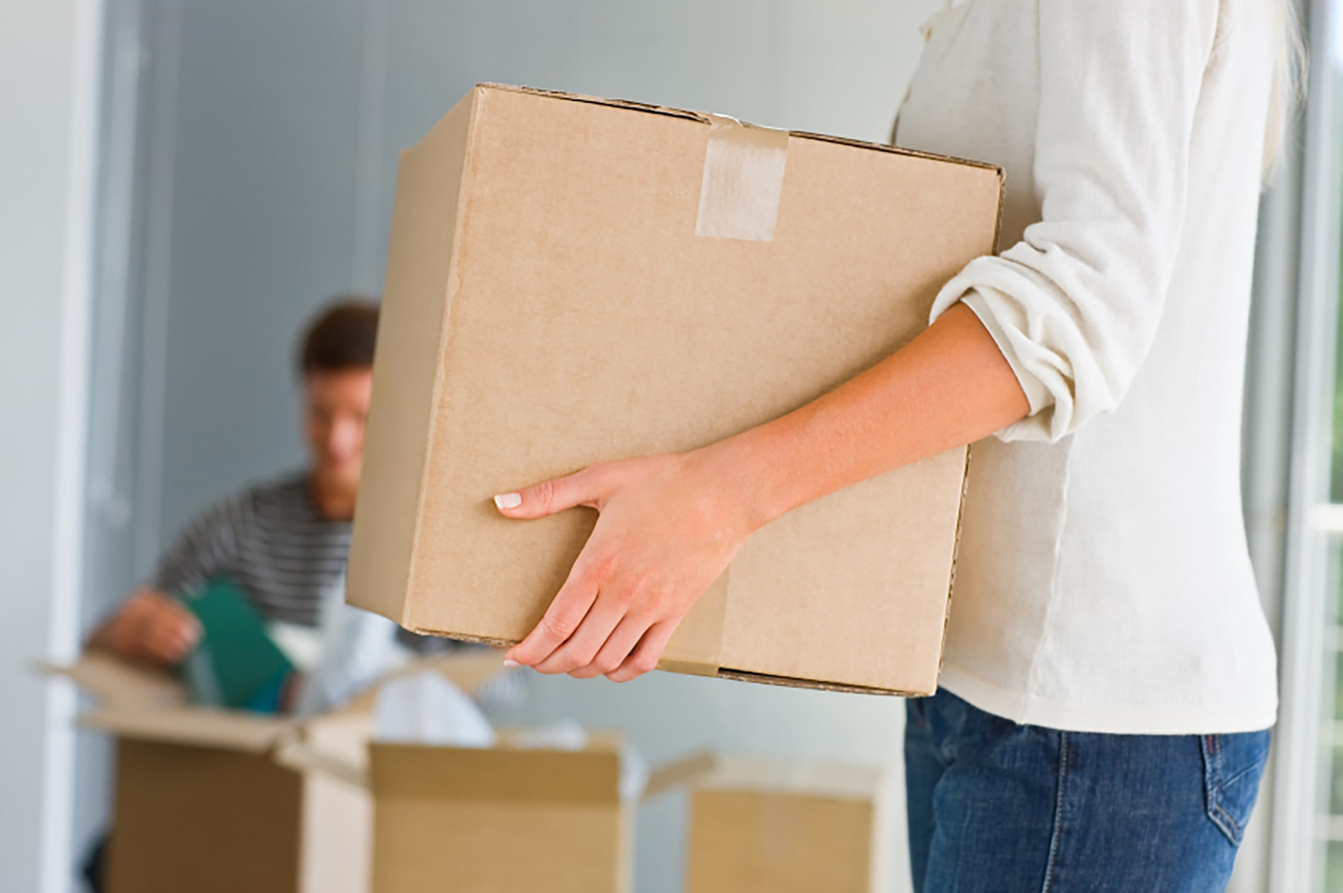 Woman holding moving box